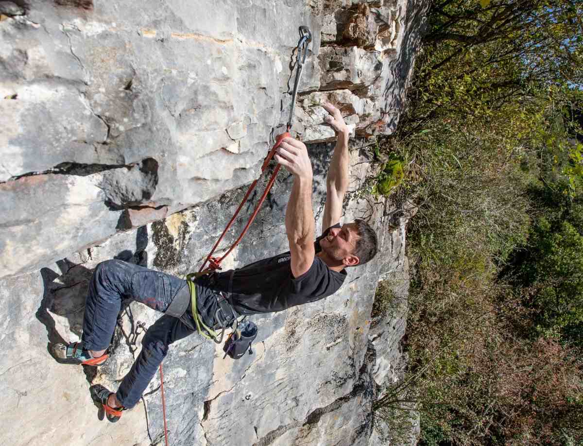 Climber in black shirt at the Pakeho crag.